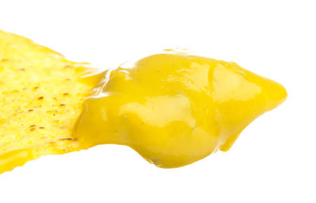 closeup of nachos with guacamole on a white background