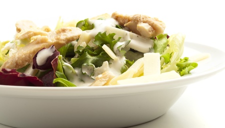 closeup of a caesar salad on white backgroundの写真素材