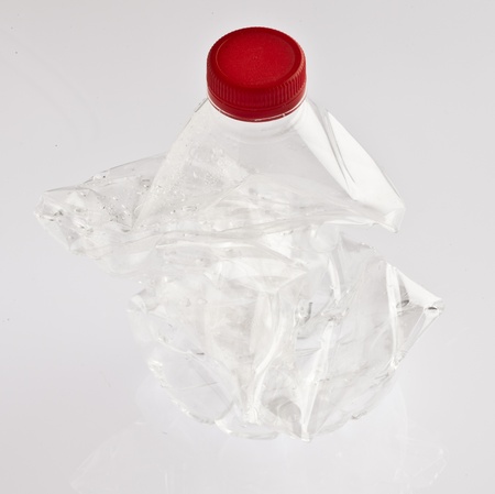 crushed bottle isolated on a white background