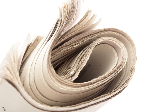 folded newspaper on a white background, closeupの写真素材