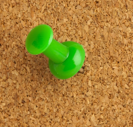 extreme closeup of a thumbtack on cork textureの写真素材