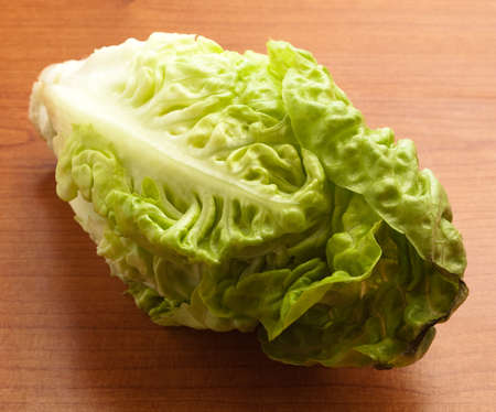 fresh lettuce on a wooden surface, closeupの写真素材
