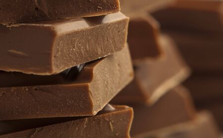 extreme closeup of a chocolate pieces towerの写真素材