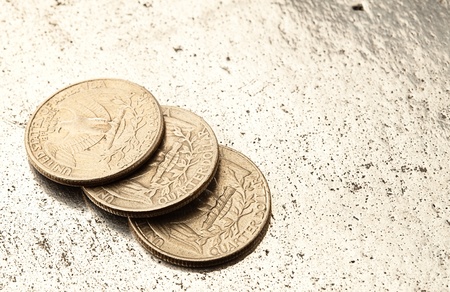 dollar coin on a metal surfaceの写真素材