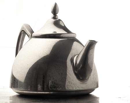 metal tea pot on a white backgroundの写真素材