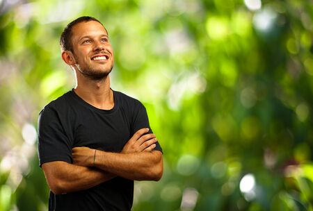 young man smiling in the park