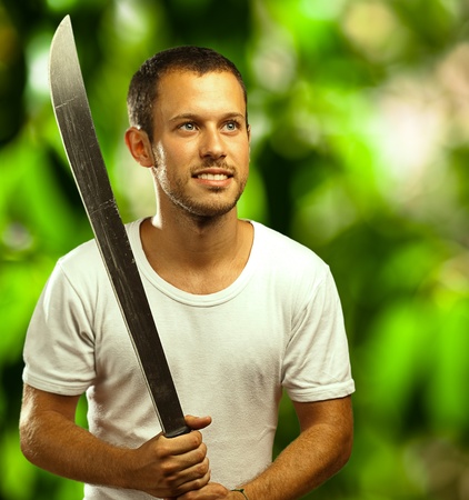 man with sword on a plants background
