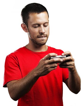 young man typing on mobile phone on white background