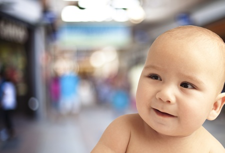 curious four month baby on a white background