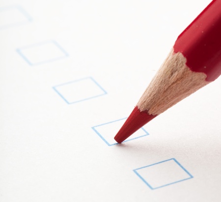 test check box and red crayons, closeup photoの写真素材