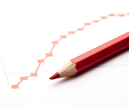 red pen painting a red line graph