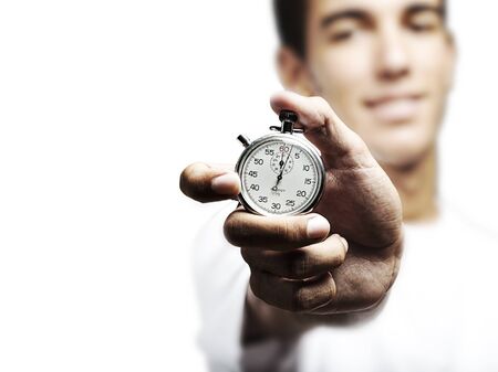 portrait of young man holding a vintage timer against a white background