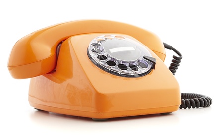 orange vintage telephone isolated on whiteの写真素材