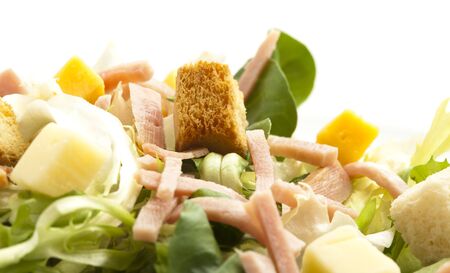 lettuce, ham and cheese salad on whiteの写真素材