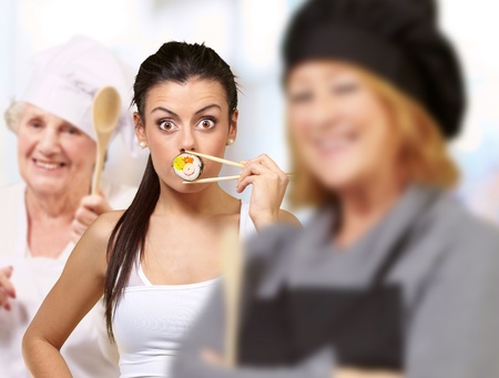 portrait of cook group gesturing over abstract backgroundの写真素材