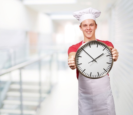Chef Holding A Big Clockの写真素材