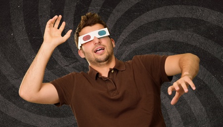 Man Watching Television In 3d Glasses On Wallpaperの写真素材