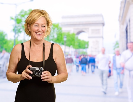 Woman Holding A Camera, Outdoorの写真素材