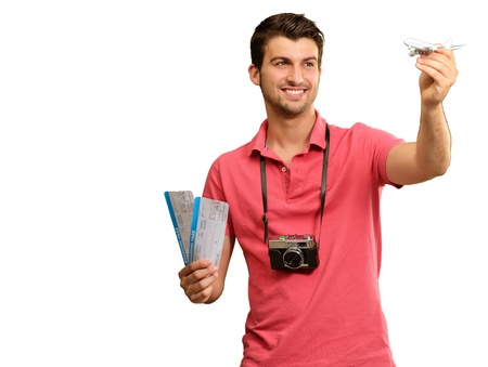 Man holding boarding pass and airplane on white backgroundの写真素材