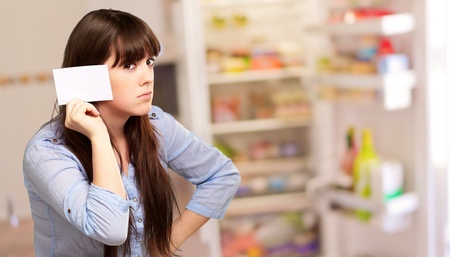 Portrait Of A Girl Holding Paper And Sad, Indoorの写真素材