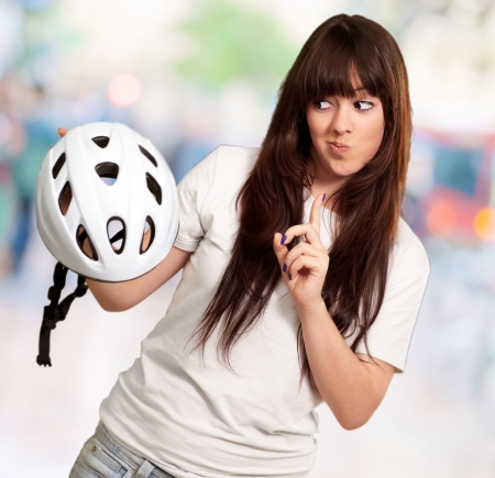 Portrait Of A Young Female Holding A Helmet, Backgroundの写真素材
