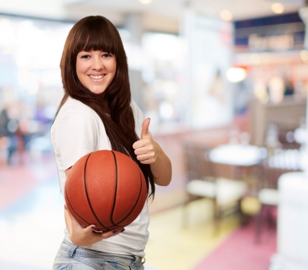 Portrait Of A Young Female With A Football Soccer Ball,indoorの写真素材