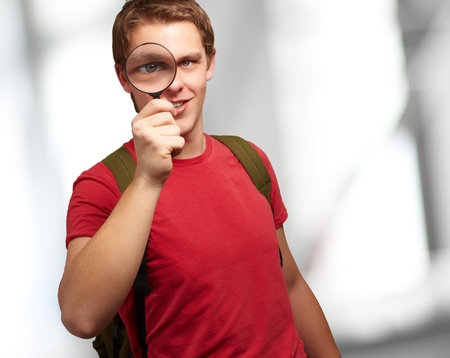 Portrait Of A Student Looking Through Magnifying Glass, Backgroundの写真素材