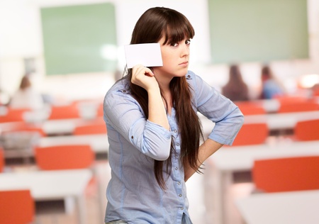 Portrait Of A Girl Holding Paper And Sad, Indoorの写真素材