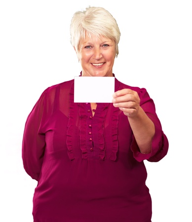 Portrait Of A Senior Woman Holding A Blank Card On White Backgroundの写真素材