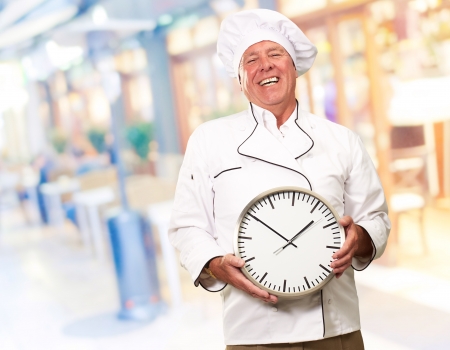 Potrait Of Chef Showing Watch, Outdoorの写真素材