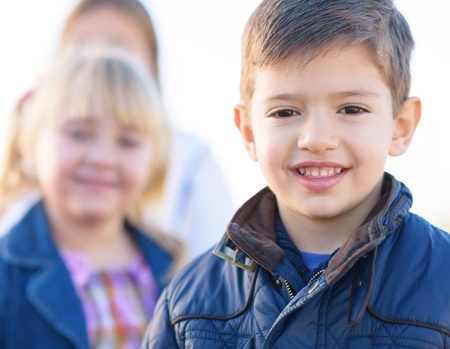 Happy Boy Standing In Front Of Girls, Outdoors
の写真素材