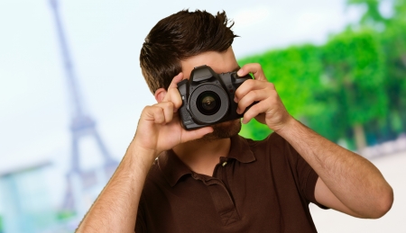 Portrait Of Young Man Capturing Photo, Outdoorsの写真素材