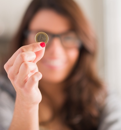 Happy Woman Holding Euro Coin, Indoors