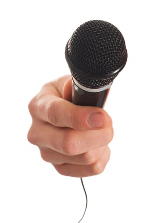 Close-up Of Hand Holding Microphone On White Backgroundの写真素材