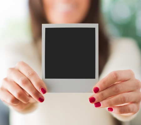 Woman Holding Blank Instant の写真素材