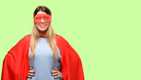 Young super woman confident and happy with a big natural smile laughingの写真素材