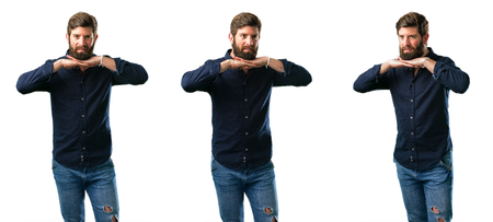 Young man with beard happy and surprised cheering expressing wow gesture isolated over white backgroundの写真素材