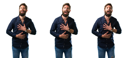 Young man with beard confident and happy with a big natural smile laughing isolated over white backgroundの写真素材