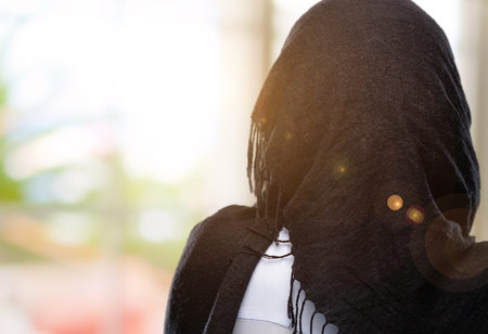Young arab woman wearing hijab backside, rear viewの写真素材