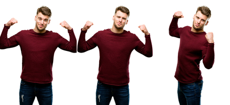 Handsome blond man showing biceps expressing strength and gym concept, healthy life its good isolated over white backgroundの写真素材