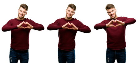 Handsome blond man happy showing love with hands in heart shape expressing healthy and marriage symbol isolated over white backgroundの写真素材