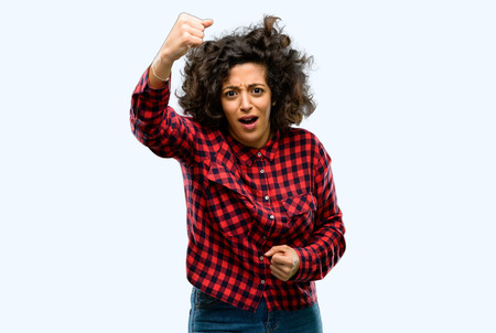 Beautiful arab woman irritated and angry expressing negative emotion, annoyed with someoneの写真素材