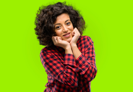 Beautiful arab woman happy and surprised cheering expressing wow gestureの写真素材