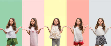 Collage of brunette hispanic girl wearing different outfits clueless and confused expression with arms and hands raised. Doubt concept.の写真素材