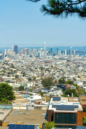 Cityscape with neighborhoods and suburban buildings with moutains and ocean background midday in...