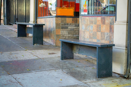 Blue turret or spire on house facade with wooden or timber pannel exterior with white accent decals and visible window with dark roof. In the neighborhood as detail shot of downtown neighborhood.の写真素材