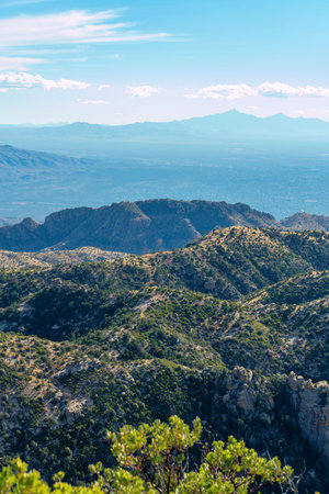 Rolling ridges and cliffs in mountains and hills of great outdoors wild western arizona at high elevation in the cliffs. Late in the day with hazy blue and white clear skies and natural landscapes.の写真素材