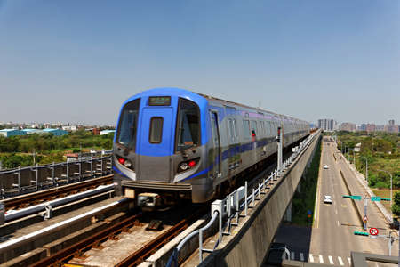 Scenic view of a metro train traveling on elevated rails of Taoyuan Mass Rapid Transit System...