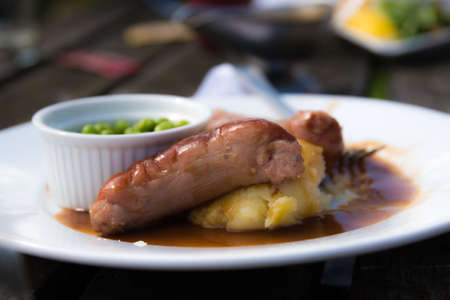 Traditional british bangers and mash served pub-style.の写真素材