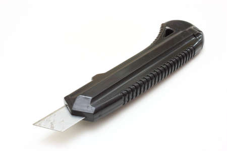 Writing knife of black color on a white background